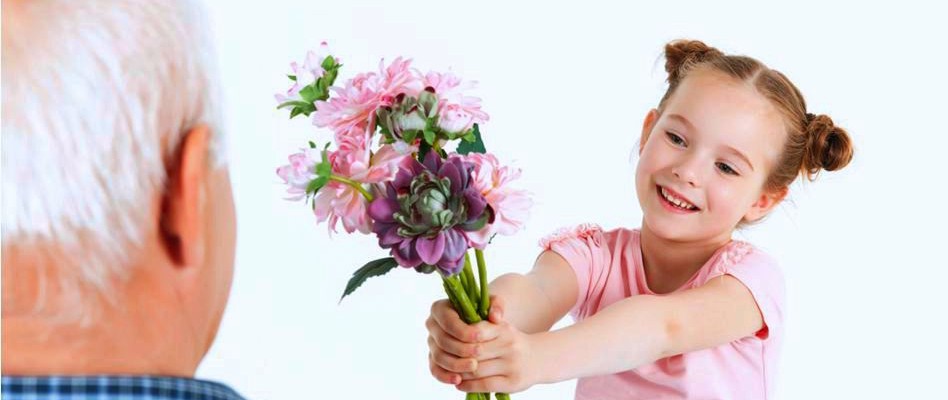 young girl giving flowers