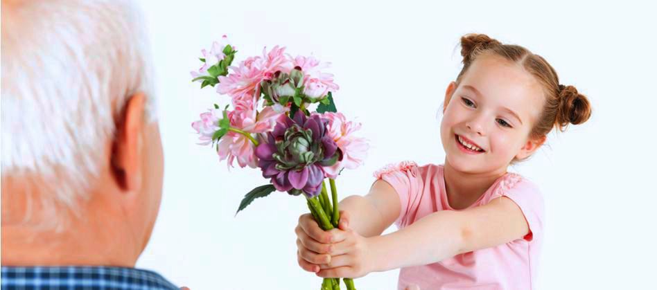 young girl giving flowers