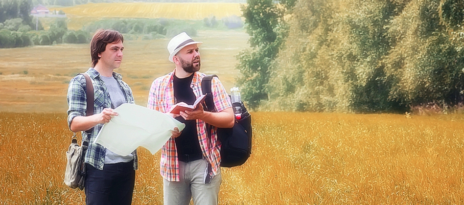 two hikers in field